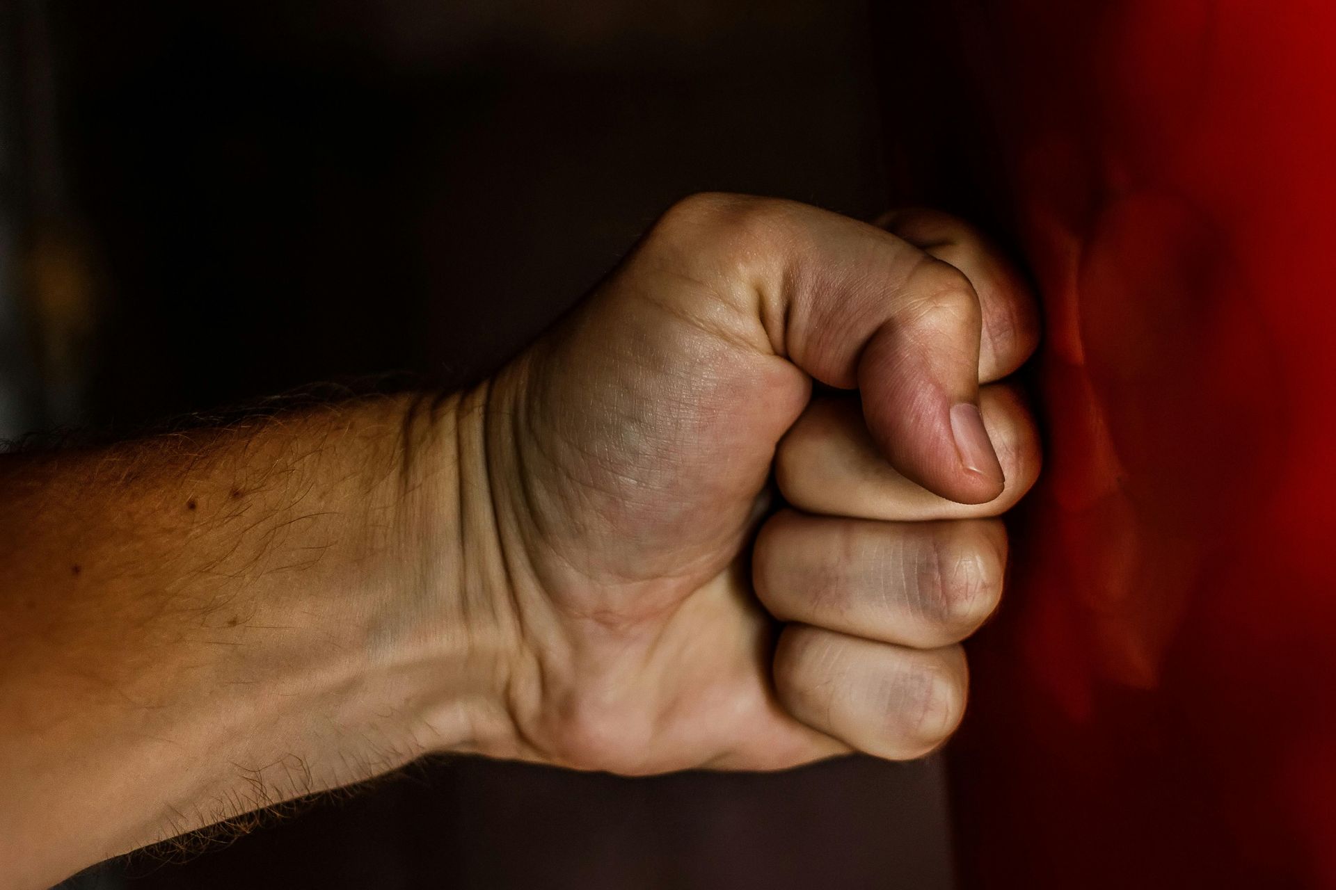 Clenched fist representing anger management